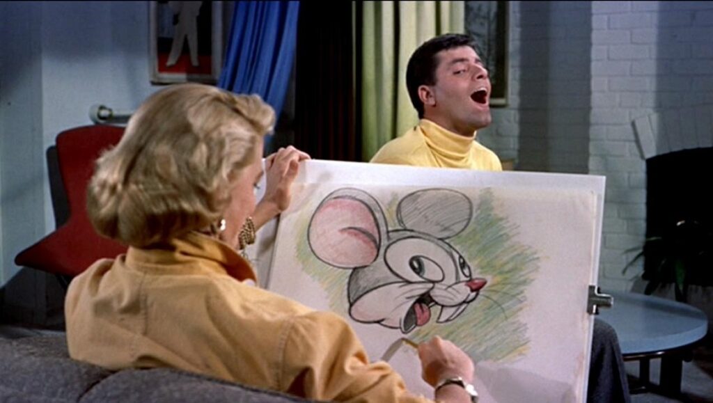 Artists and Models | Frank Tashlin Artists and Models film scene: Jerry Lewis with a cartoon drawing of a mouse.