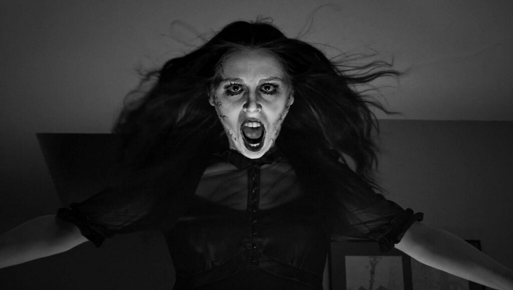 A Ghost Waits | Adam Stovall Black and white image from A Ghost Waits film. Screaming woman, horror movie scene.