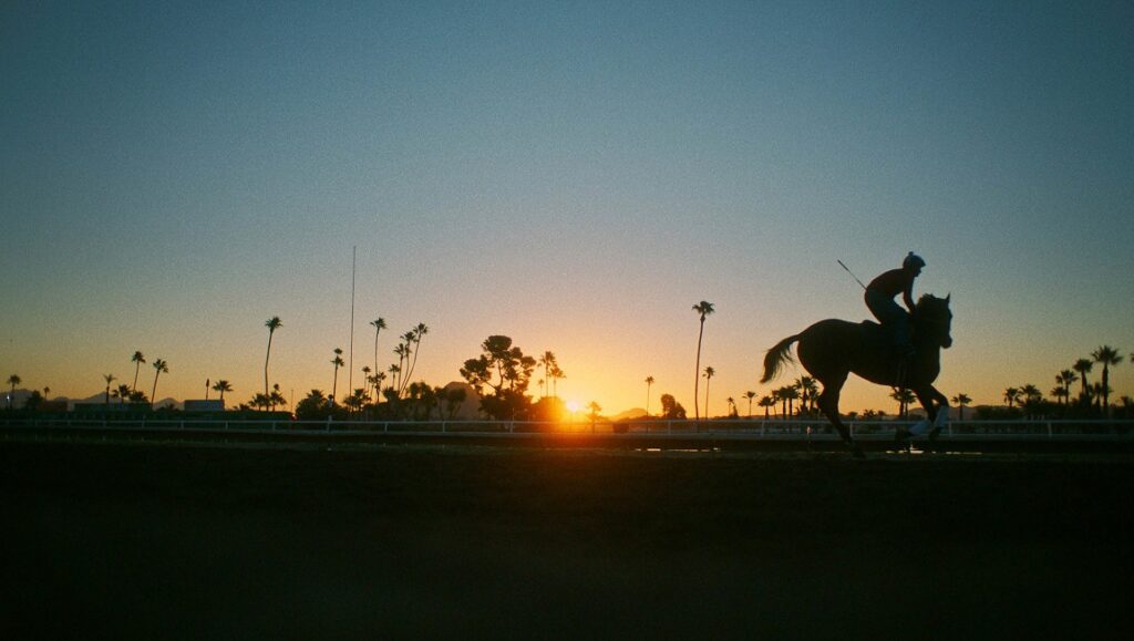 Jockey | Clint Bentley Silhouette of a jockey riding a horse at sunset. Sundance Film Festival film Jockey promotional still.