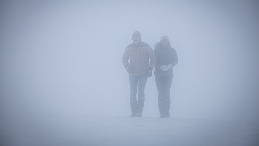 Red Dot | Alain Darborg Alain Darborg's Red Dot: Couple in dense fog, mysterious and obscured.