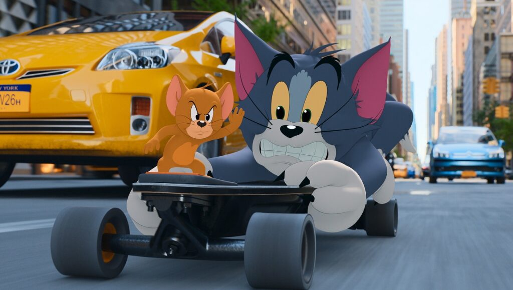Tom and Jerry | Tim Story Tom and Jerry movie scene. Jerry stands on Tom's head as he rides a go-kart through city streets.