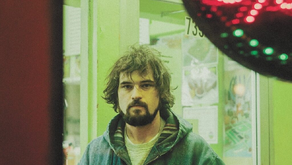 Ryley Walker | Deep Fried Grandeur Ryley Walker album review, February 2021. Portrait of musician with beard and hooded jacket. New music.