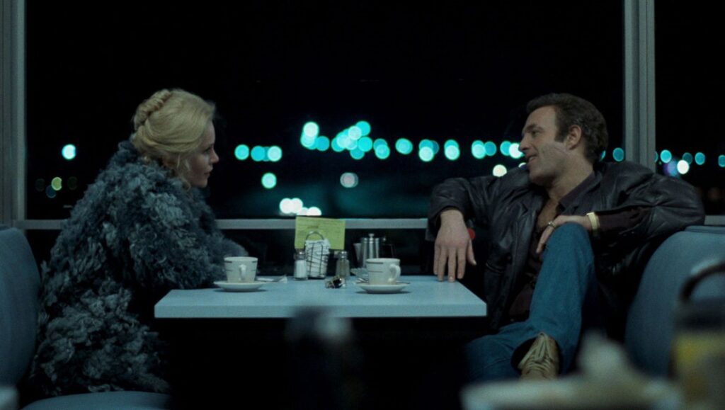 Still from Thief (1981) directed by Michael Mann. James Caan and Tuesday Weld in a diner at night.