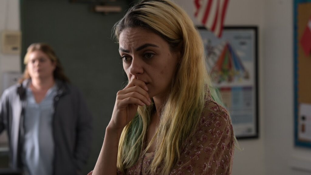 Four Good Days | Rodrigo García Mila Kunis in Four Good Days. A woman with blonde hair looks concerned, hand to her face. Drama movie scene.