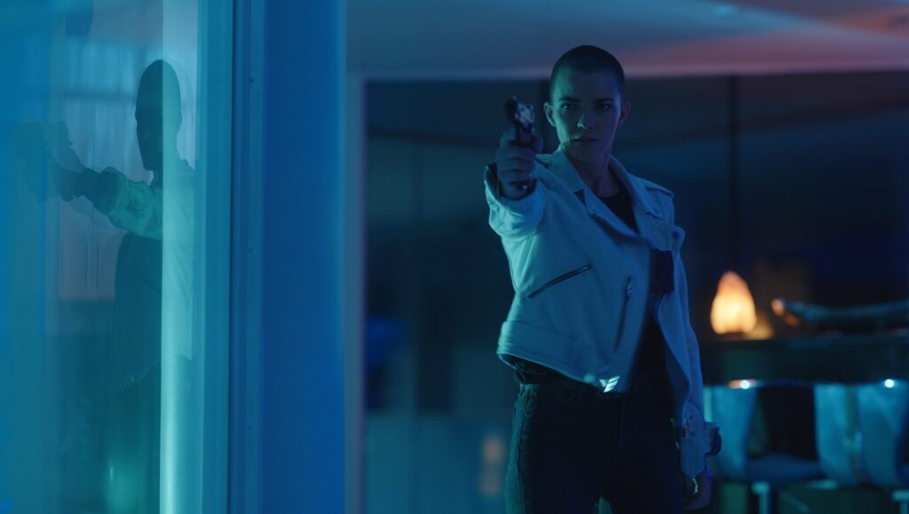 Vanquish | George Gallo Vanquish movie still. Woman with gun, white jacket. Action, thriller film. George Gallo.