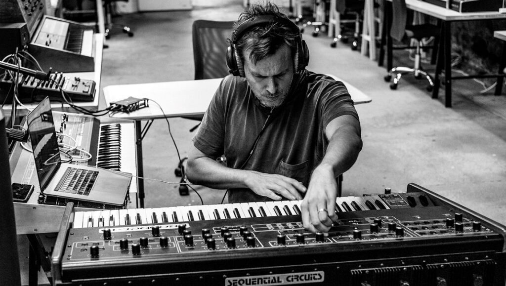 Clark | Playground in a Lake The Alchemist creating Haram album music. Man with headphones on synthesizer. Armand Hammer album.