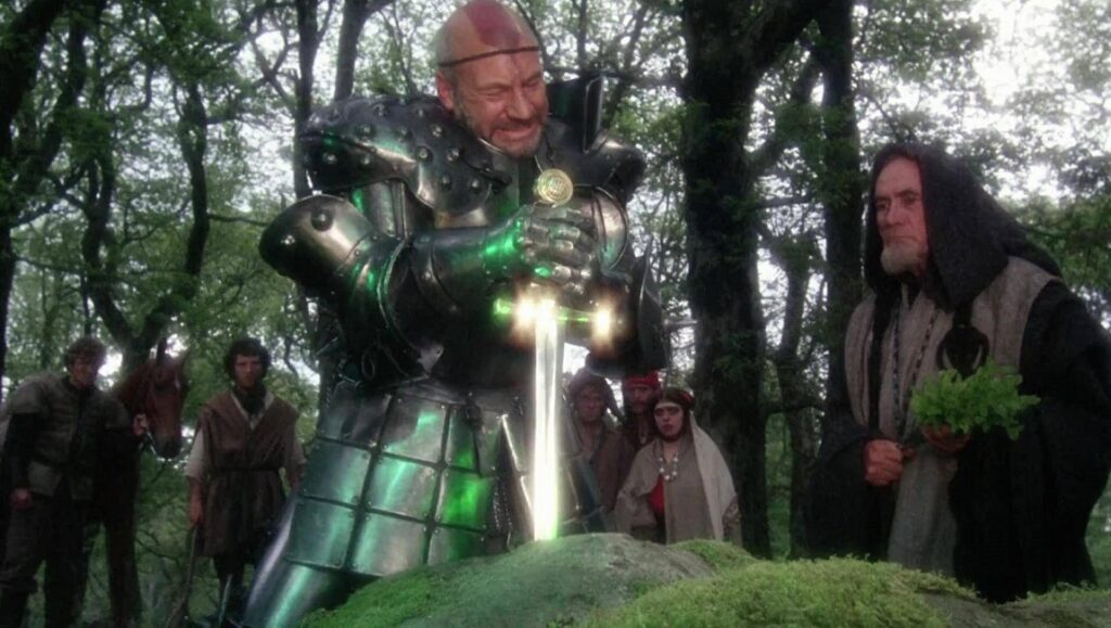 Excalibur | John Boorman Excalibur movie scene. A knight pulls the sword Excalibur from a stone, Merlin watches.