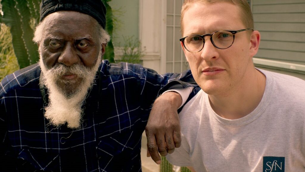 Tokyo Jetz Cancel Culture promo image: Two men pose. One is an older Black man with a white beard, the other is a younger white man with glasses.