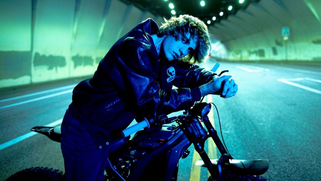 Album Roundup — March 2021 | Part 3: Justin Bieber, Tune-Yards, Floating Points Justin Bieber on a motorcycle in a tunnel. New music album roundup, March 2021.