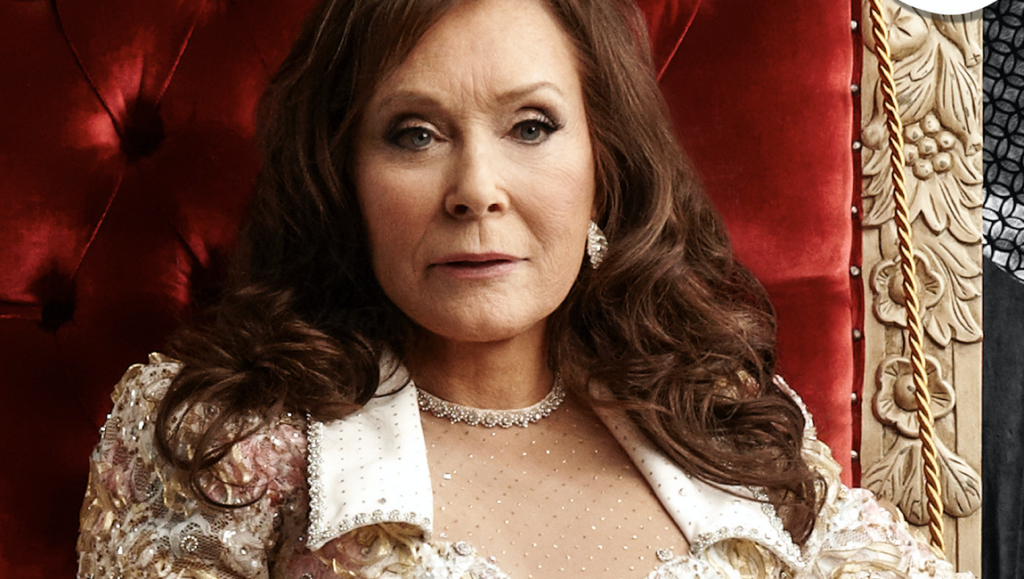 Loretta Lynn | Still Woman Enough Loretta Lynn, March 2021 album roundup. Country music singer in embellished white dress.