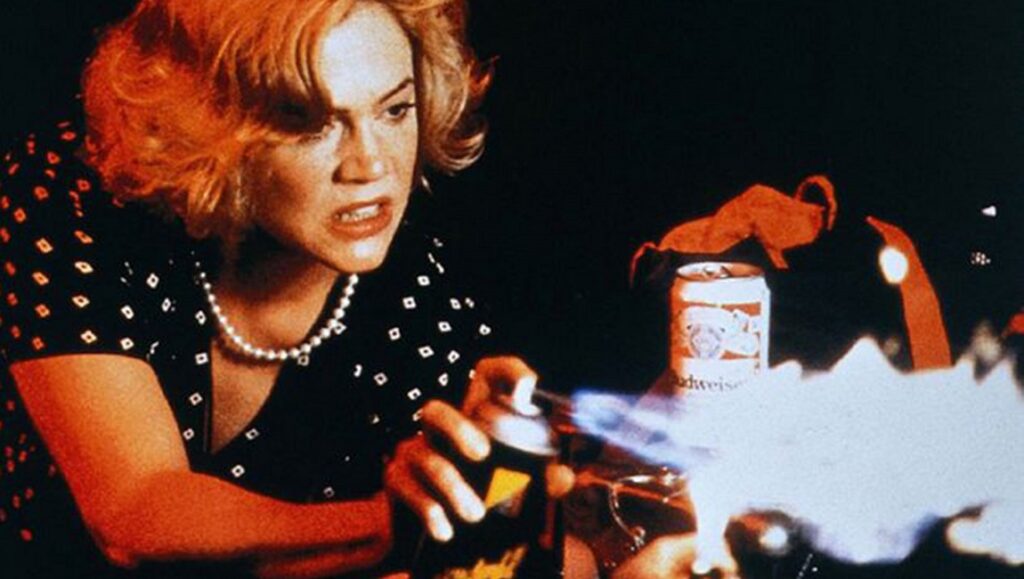 Serial Mom | John Waters Kathleen Turner in Serial Mom, a John Waters film. She holds a spray can with a flame.