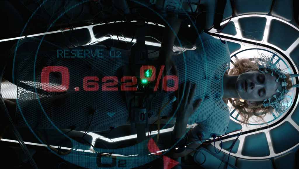 Oxygen movie still. Woman in medical pod with low oxygen levels. Alexandre Aja film.