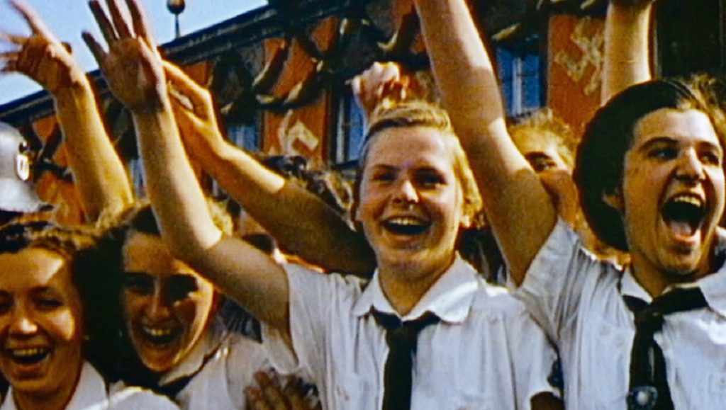 Final Account | Luke Holland Final Account film still: Young women with arms raised in Nazi Germany.