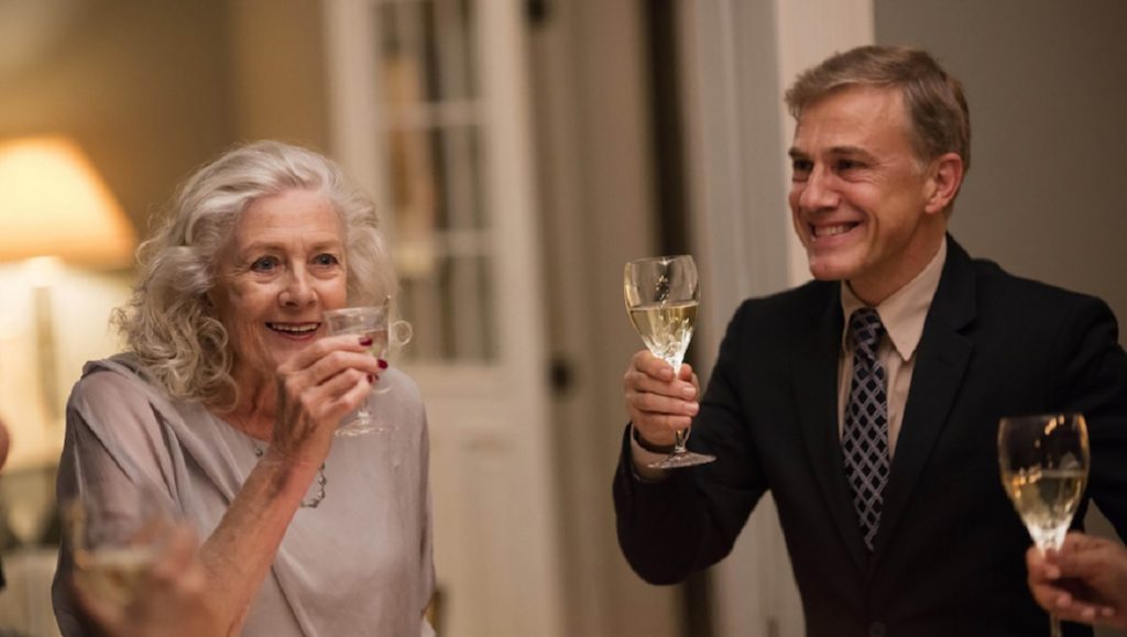 Georgetown | Christoph Waltz Christoph Waltz in Georgetown. Waltz and an older woman toast with wine.