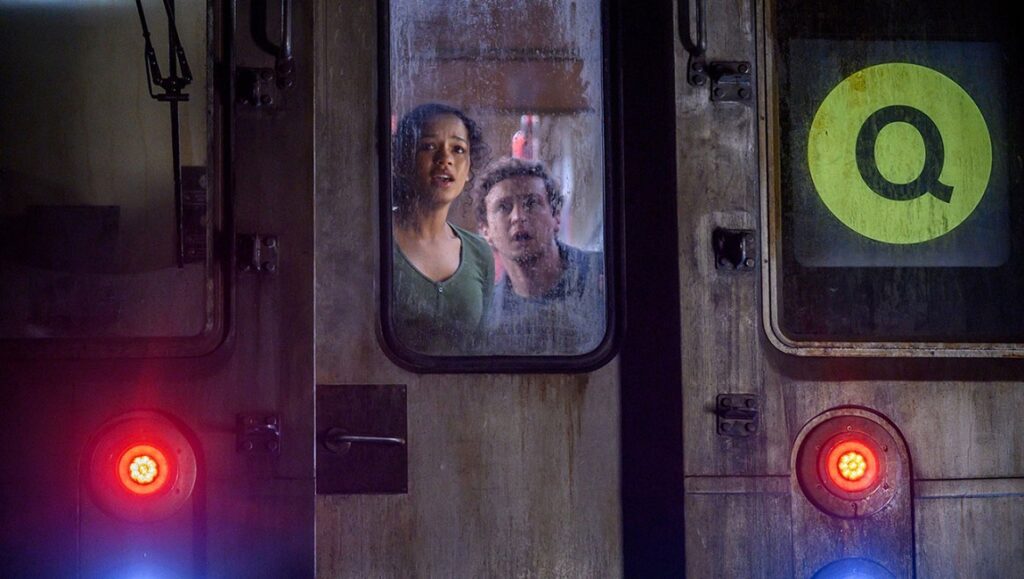 Escape Room: Tournament of Champions | Adam Robitel Escape Room: Tournament of Champions movie scene. Two scared people trapped in a subway car.