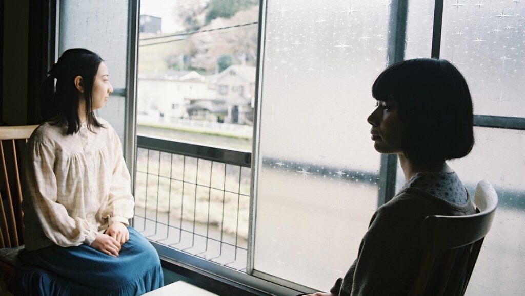 FIDMarseille 2021 — Dispatch 2: Haruhara San’s Recorder, The Invisible Mountain, Just a Movement Haruhara San's Recorder film still. Two women sit by a window, gazing outwards. FIDMarseille 2021.