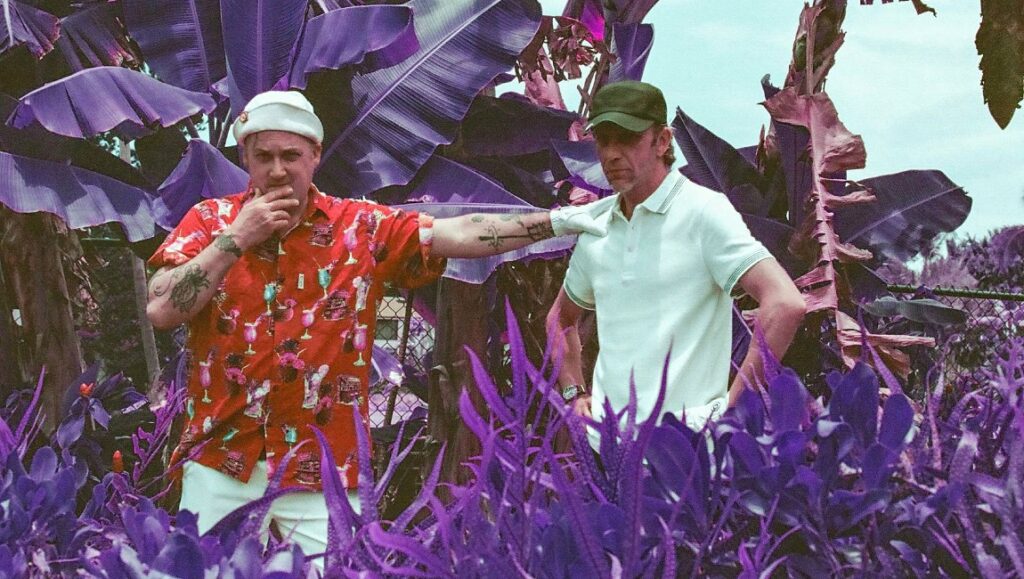 Modest Mouse | The Golden Casket Modest Mouse, alternative band, in a purple-toned tropical setting. Indie music promo image.