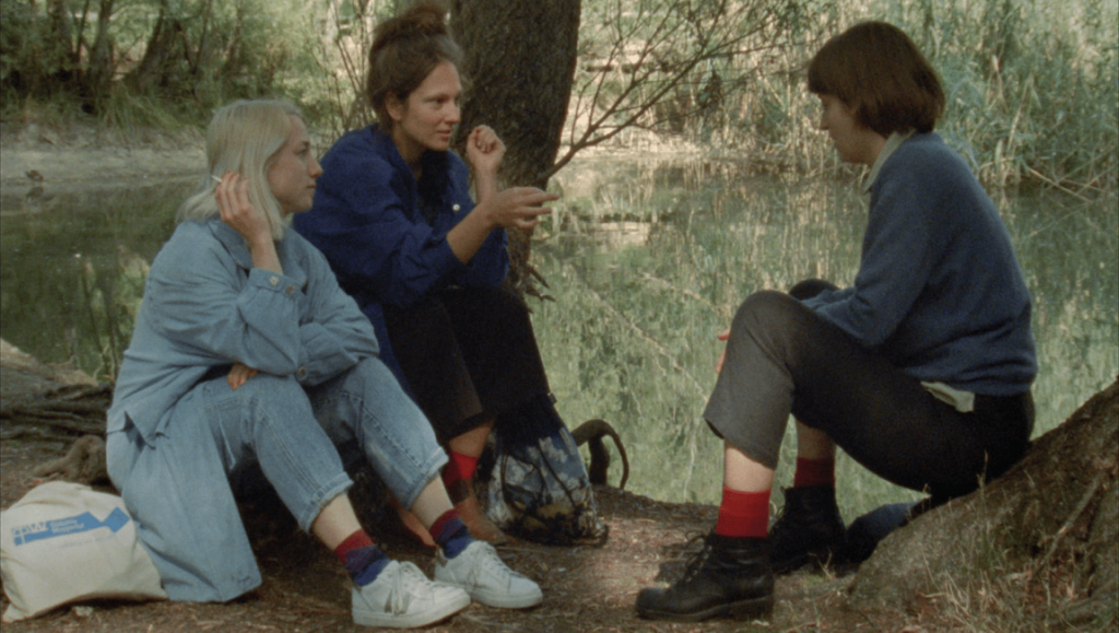 FIDMarseilles film festival scene. Three women sit outdoors, discussing Outside Noise, Topology of Sirens, and Beatrix.