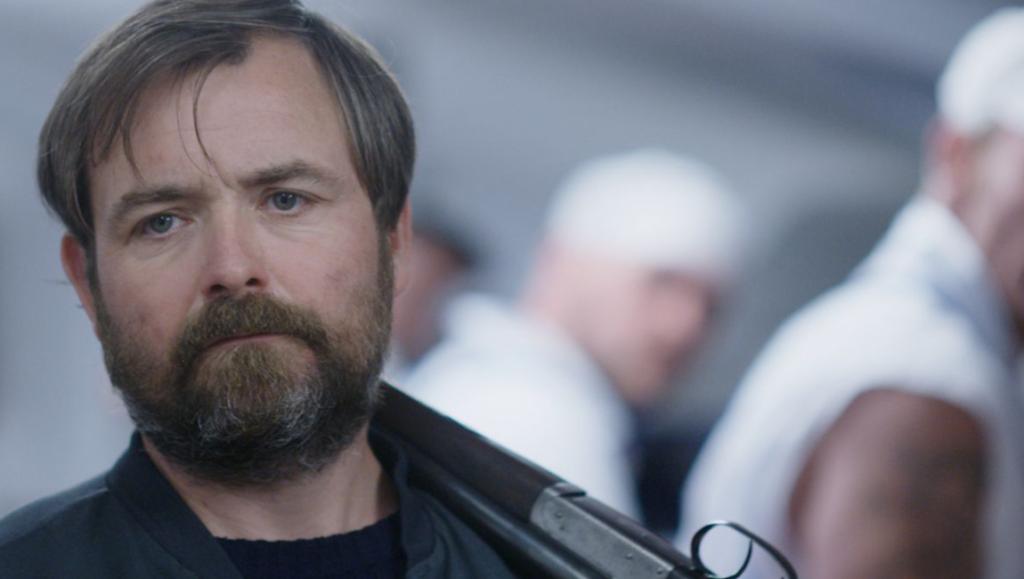 Still from Bull at Fantasia Fest 2021. Man with a shotgun.