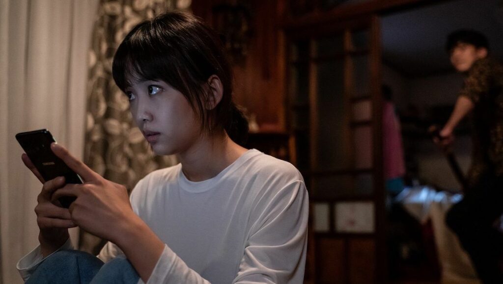 Midnight — Kwon Oh-seung Midnight film still from Fantasia Fest. Woman with phone, man with knife. Korean thriller.