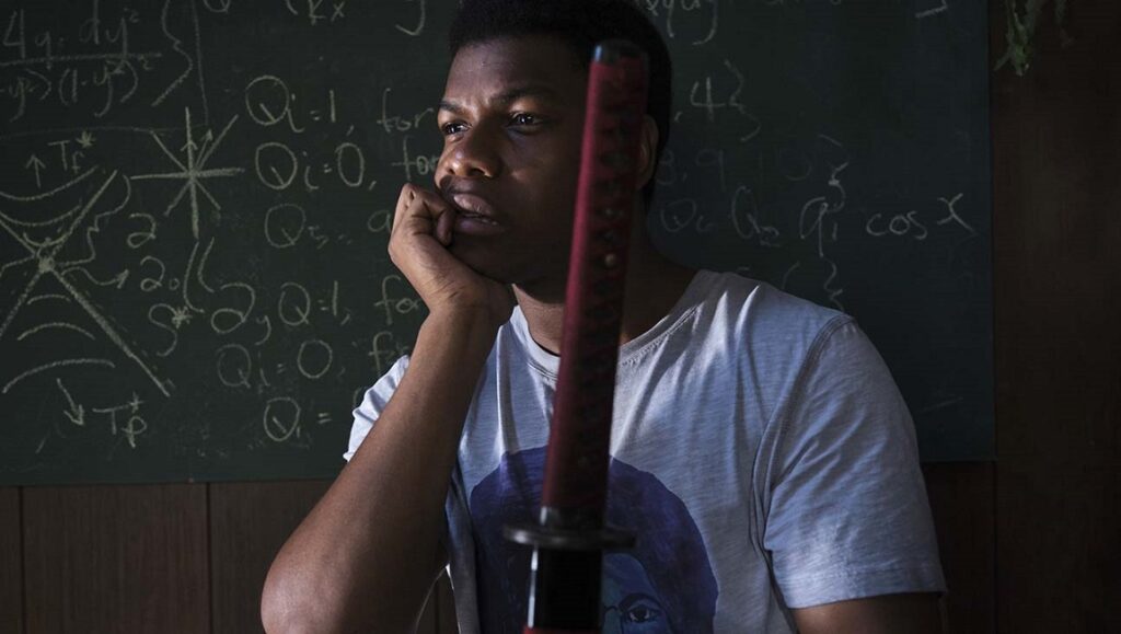 Naked Singularity | Chase Palmer John Boyega in Naked Singularity movie. Man with sword in front of chalkboard.
