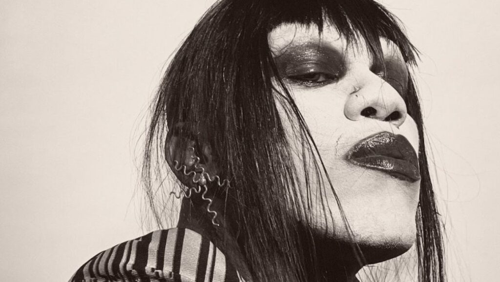 Yves Tumor | The Asymptotical World EP Yves Tumor portrait. Black and white photo of the musician with dark makeup and hair.