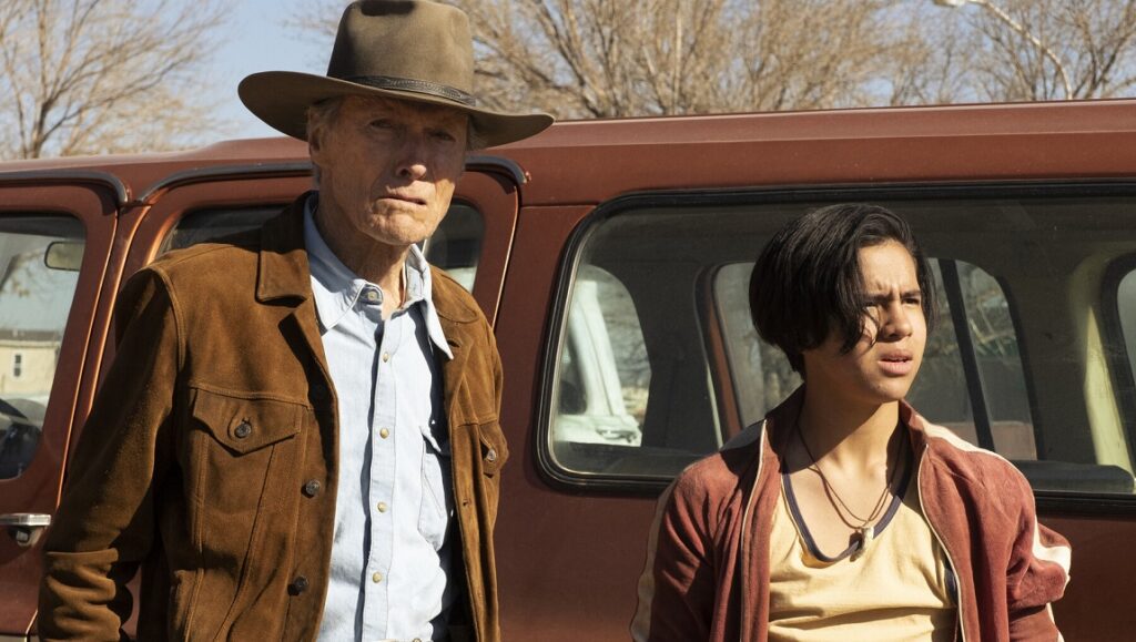 Clint Eastwood in Cry Macho with young actor. Western film scene.