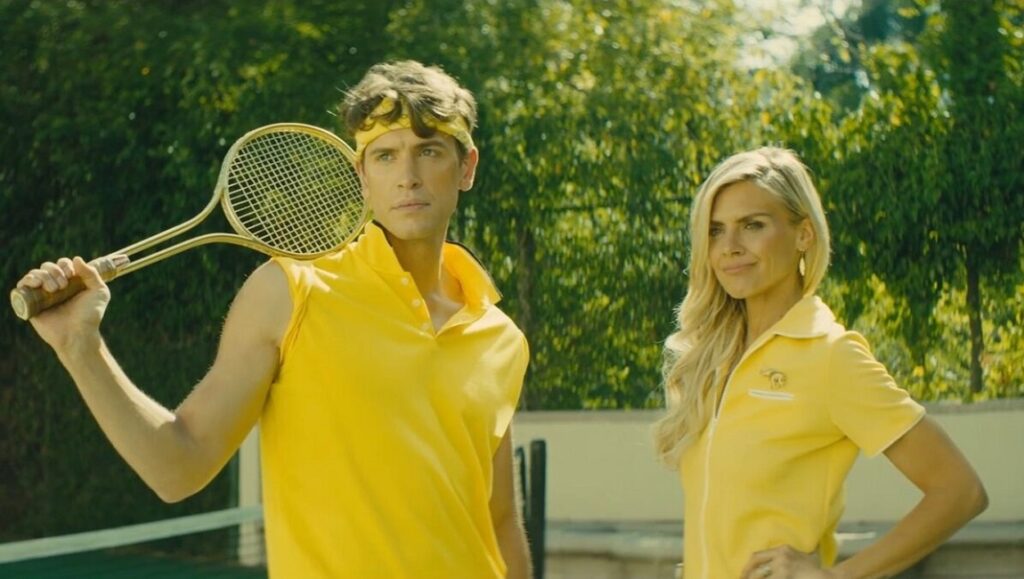 The Estate image: James Kapner, man with tennis racket and woman in yellow outfits on court.