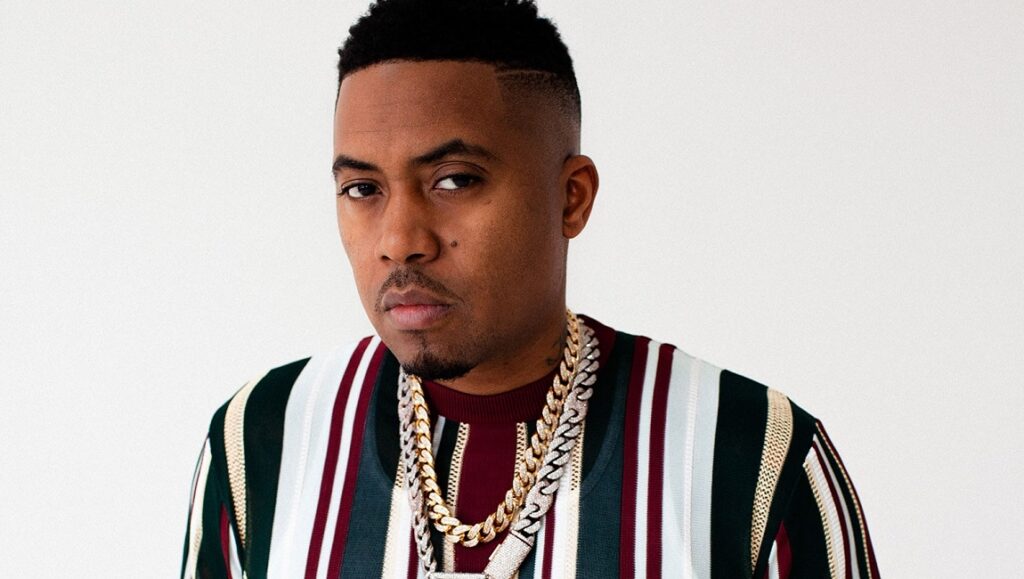 Nas, the rapper, in August 2021. New album review. Striped shirt and gold chain.