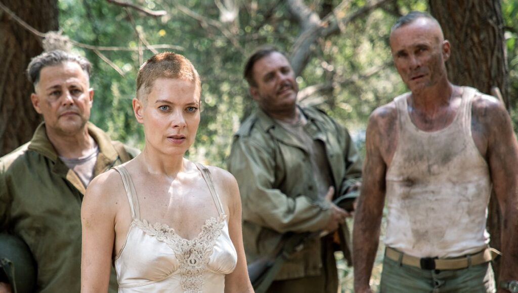 Hell Hath No Fury movie still. Nina Bergman and soldiers in a WWII action scene.