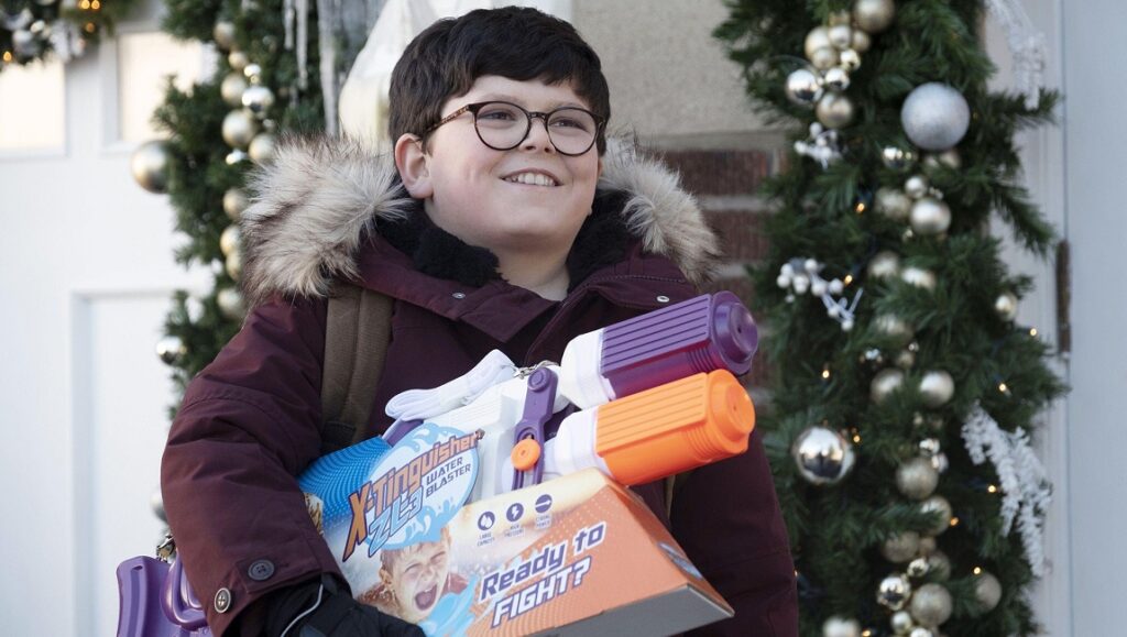 Home Sweet Home Alone | Dan Mazer Home Sweet Home Alone scene: Boy with water blasters, Christmas decorations.