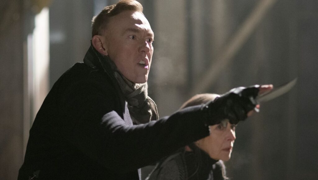 A dangerous man with a knife. Action scene with a weapon. Thriller movie.