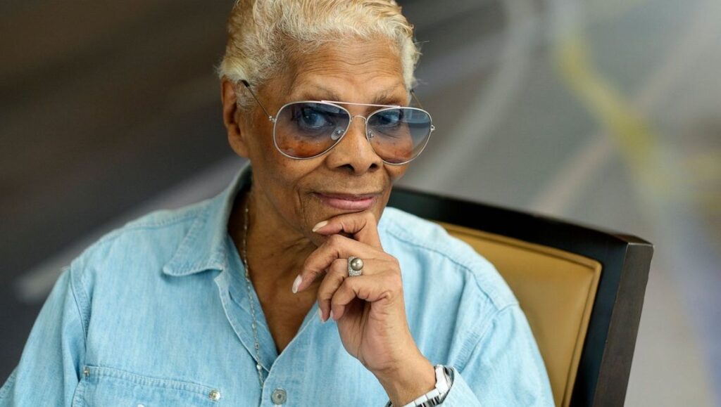 Dionne Warwick: Don’t Make Me Over | David Heilbroner and Dave Wooley Dionne Warwick at DOC NYC 2021. Singer with aviator glasses and light blue shirt. Documentary film festival.