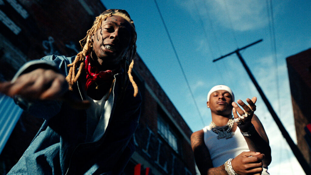 Lil Wayne & Rich the Kid | Trust Fund Babies Lil Wayne and Rich the Kid. Rappers in music video. Hip hop artists. Urban scene with blue sky.