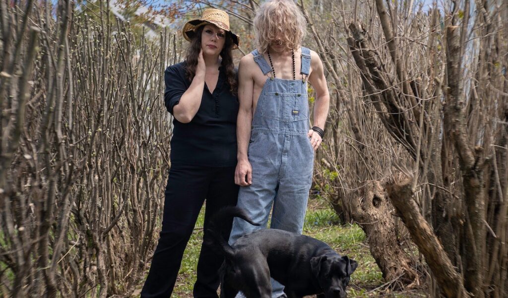 Best Albums of 2021: Low | HEY WHAT Low band members Mimi Parker and Alan Sparhawk with dog. Top albums of 2021.