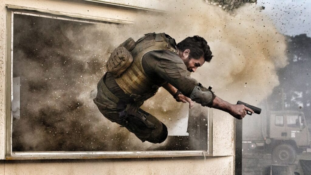 One Shot | James Nunn One Shot movie scene. Soldier jumps through a window with a gun amidst an explosion. Action film.