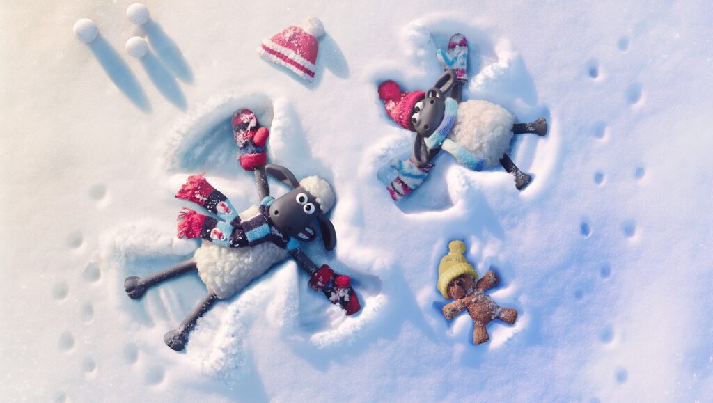 Shaun the Sheep: The Flight Before Christmas. Sheep and a teddy bear making snow angels. Winter holiday fun.