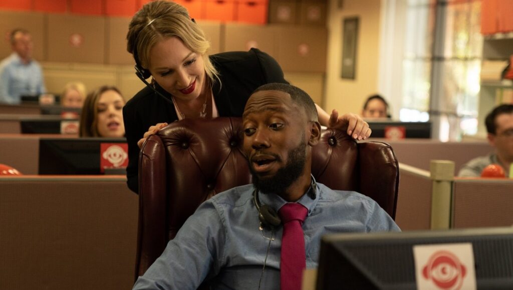 Death of a Telemarketer | Khaled Ridgeway The Death of a Telemarketer scene. Man in chair, woman behind. Office setting.