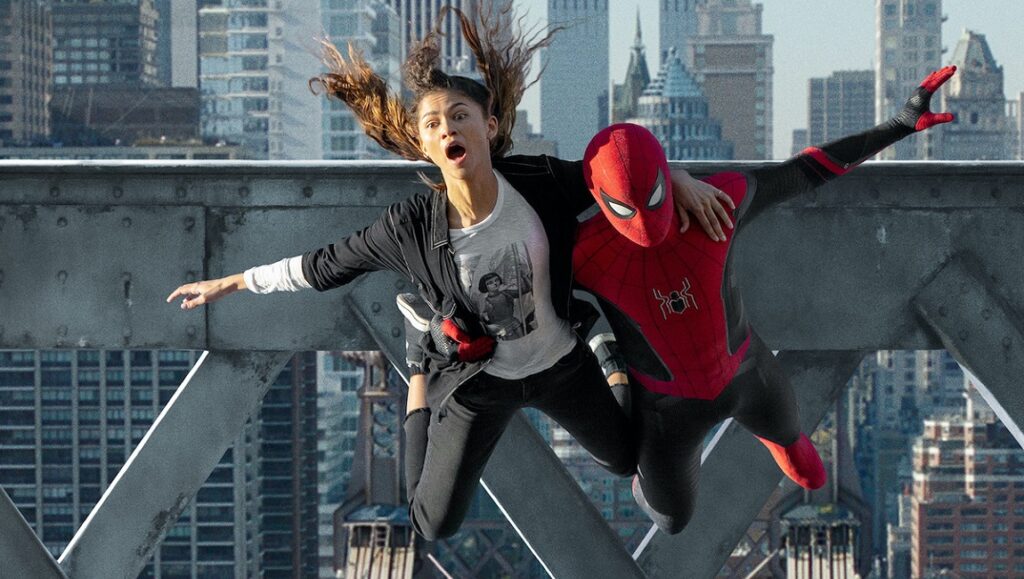 Spider-Man: No Way Home | Jon Watts Zendaya and Spider-Man in No Way Home. MJ falls, saved by Spider-Man. Action scene with city skyline backdrop.