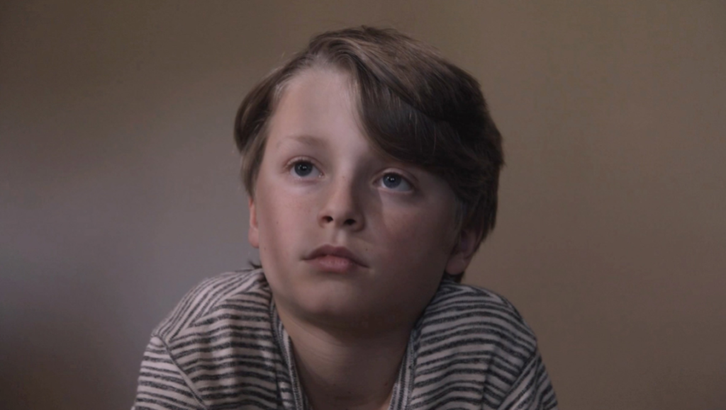 Sundance Film Festival 2022 — Dispatch 1: The Cathedral, Utama, Call Jane Still from The Cathedral at Sundance Film Festival. Young boy looking up. Indie film.