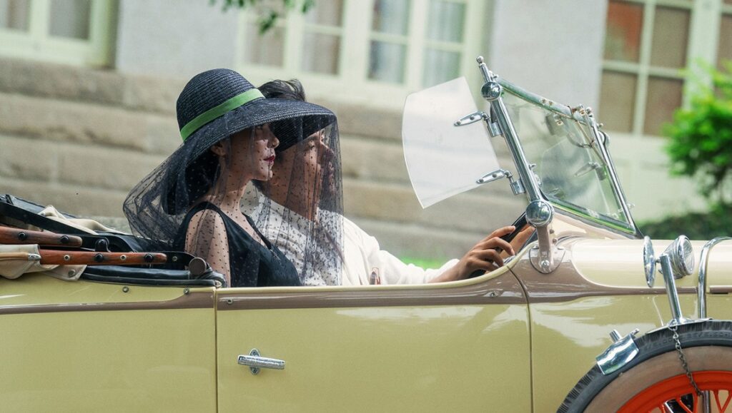 Love After Love — Ann Hui IFFR 2022: Couple in vintage car. Woman wears hat with veil. Love After Love film still.