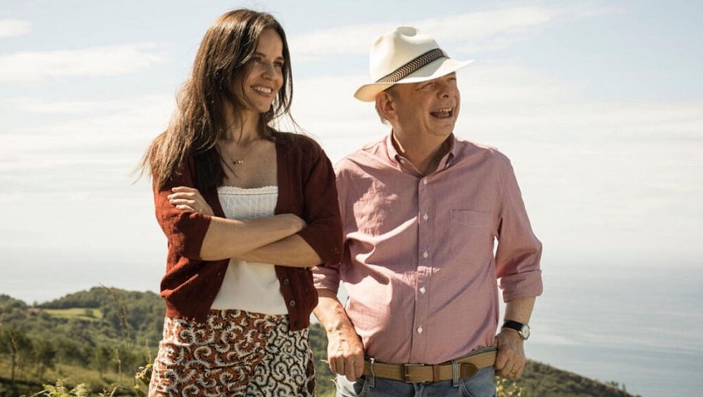 Rifkin's Festival movie scene featuring Elena Anaya and Wallace Shawn outdoors. Woody Allen film.