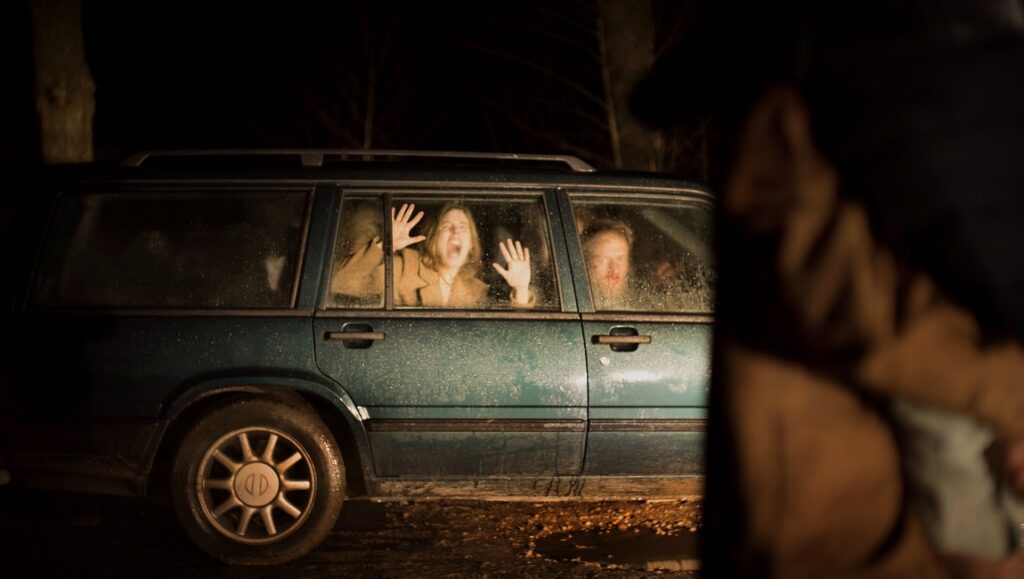 Speak No Evil — Christian Tafdrup Speak No Evil film scene. Family trapped in car, looking scared. Sundance Film Festival 2022. Horror movie.