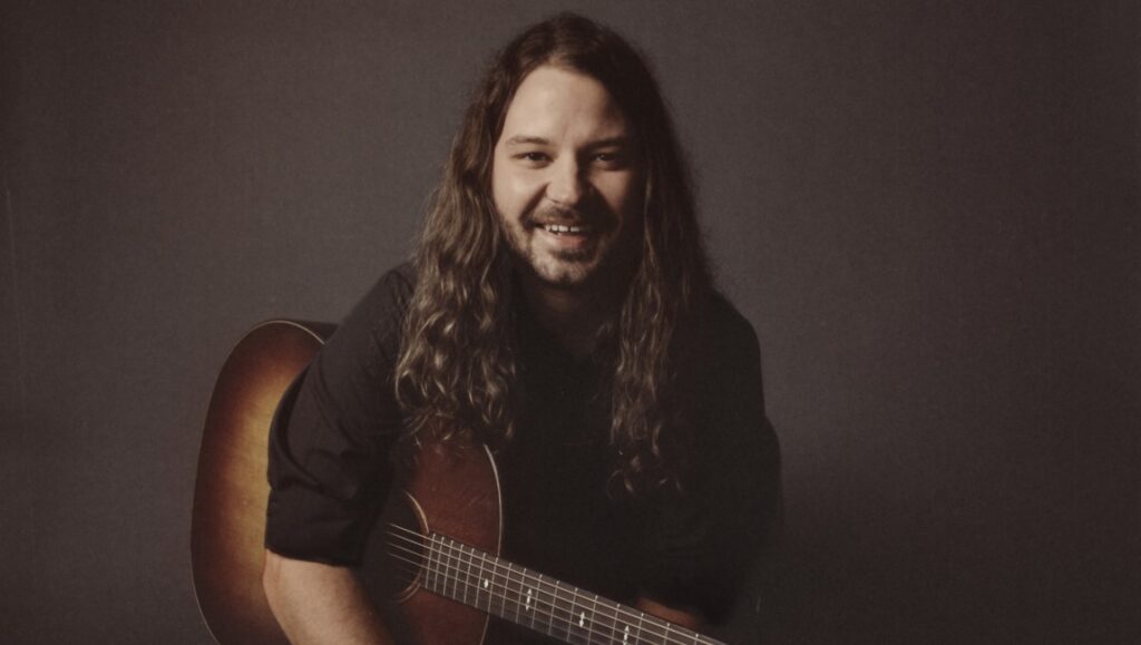 Brent Cobb, January 2022 album roundup. Singer-songwriter with guitar. Country music artist.
