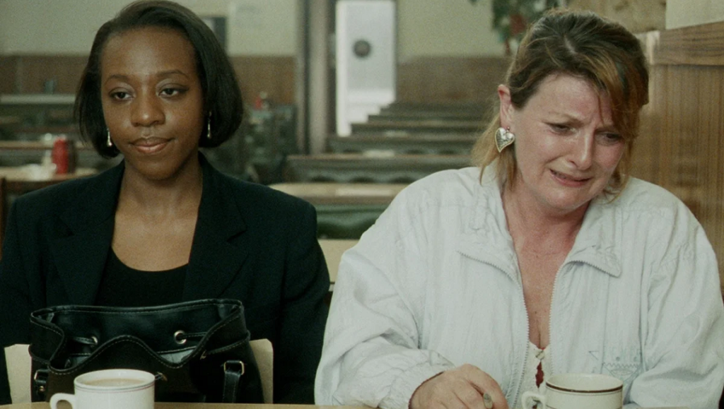 Secrets & Lies — Mike Leigh Secrets & Lies movie still. Brenda Blethyn cries as Marianne Jean-Baptiste looks on. Mike Leigh film.