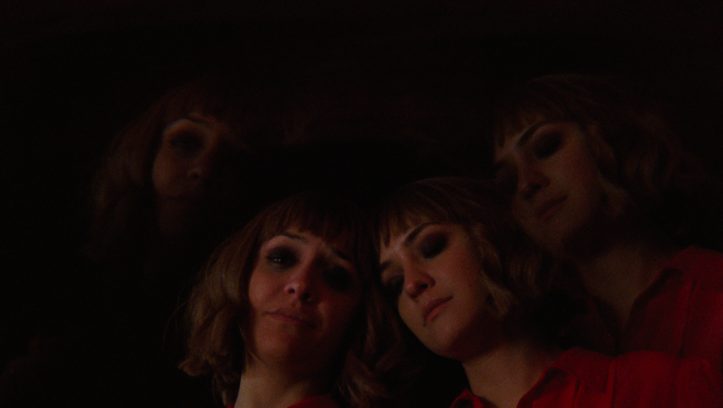 Multiple exposures of woman in red, Superior film by Erin Vassilopoulos.