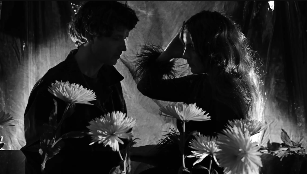 Beach House — Once Twice Melody Black and white image of Beach House band members with flowers. Indie music.