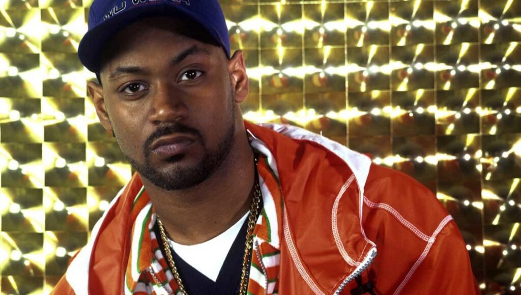 Ghostface Killah, Supreme Clientele era. Rapper portrait with gold chain and blue cap.