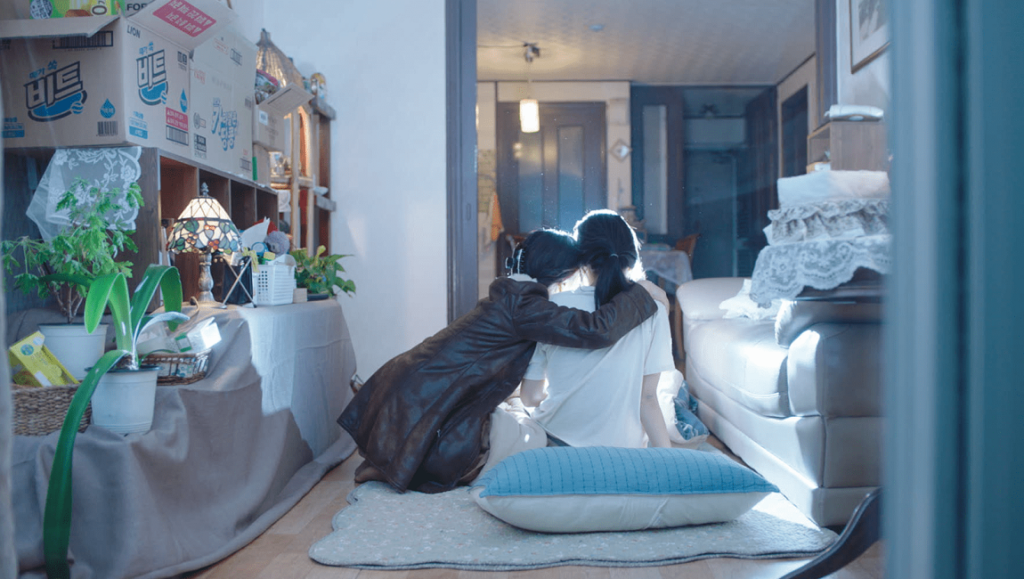 The Apartment with Two Women film still. Two women embrace in an apartment. New Directors/New Films 2022.