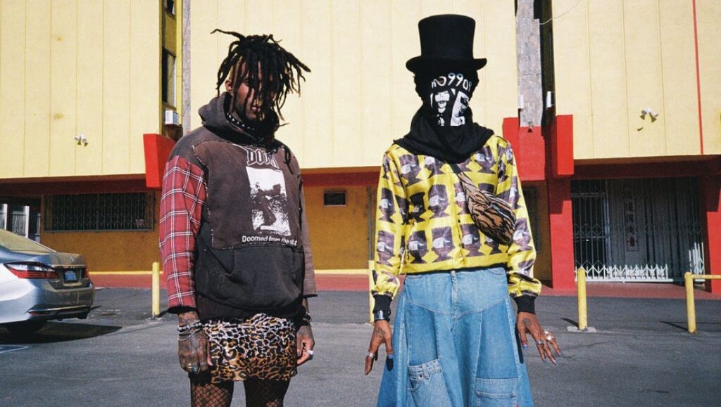Ho99o9 — Skin Ho99o9 promo image for Skin. Two members in avant-garde punk fashion.
